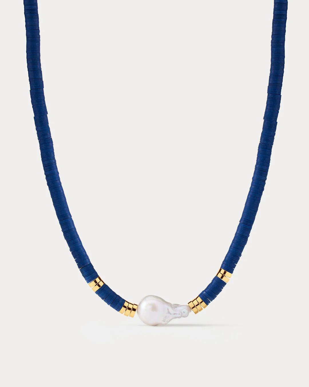 beaded necklace in navy with a pearl in the middle