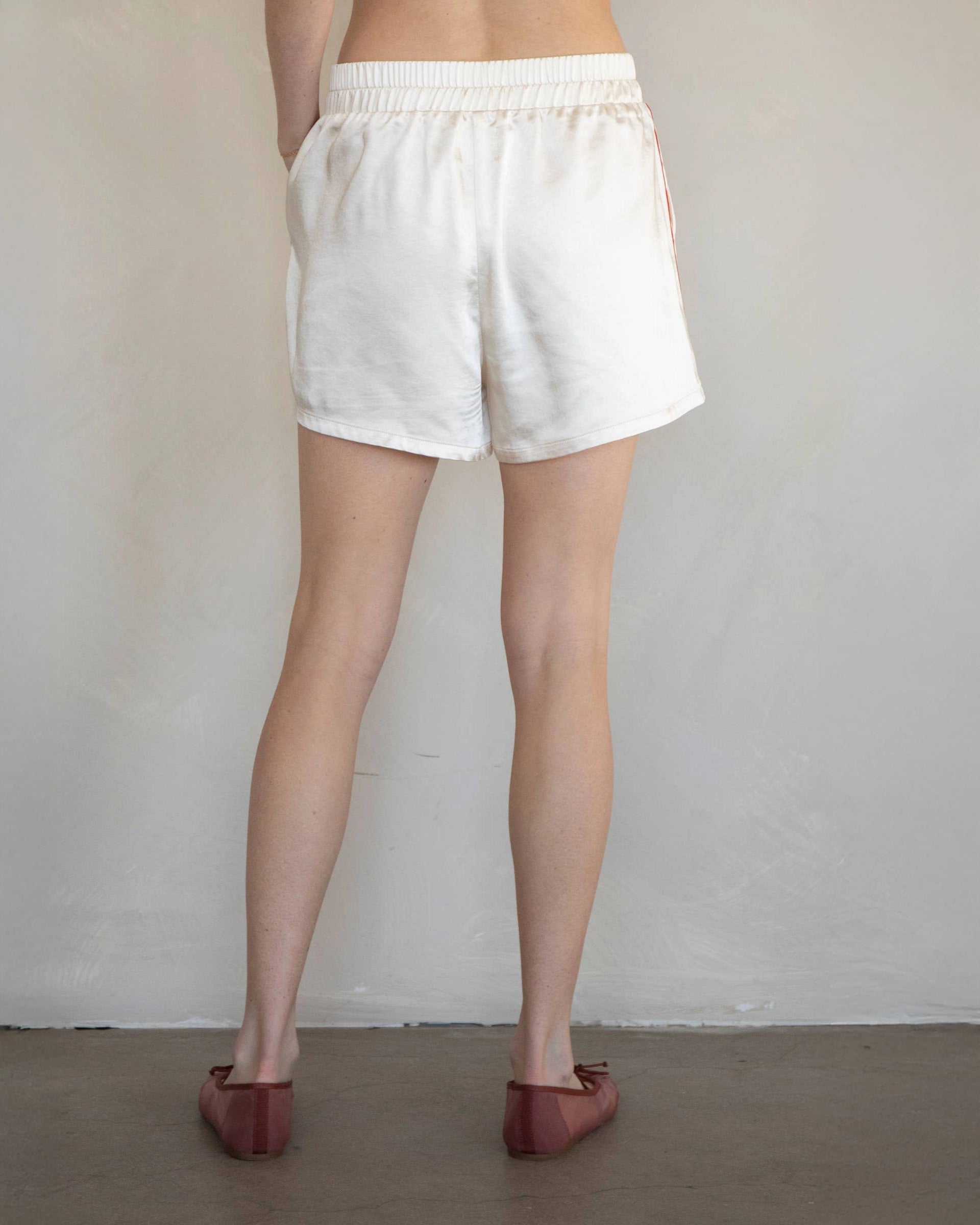 White Shorts with red stripes down the side with elastic waist