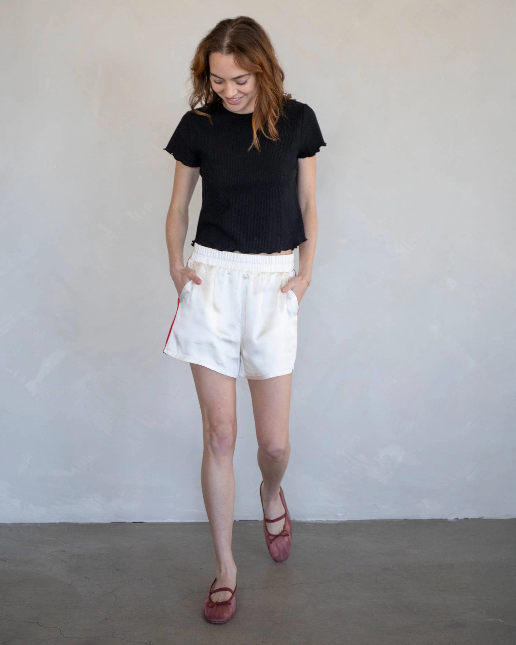 White Shorts with red stripes down the side with elastic waist