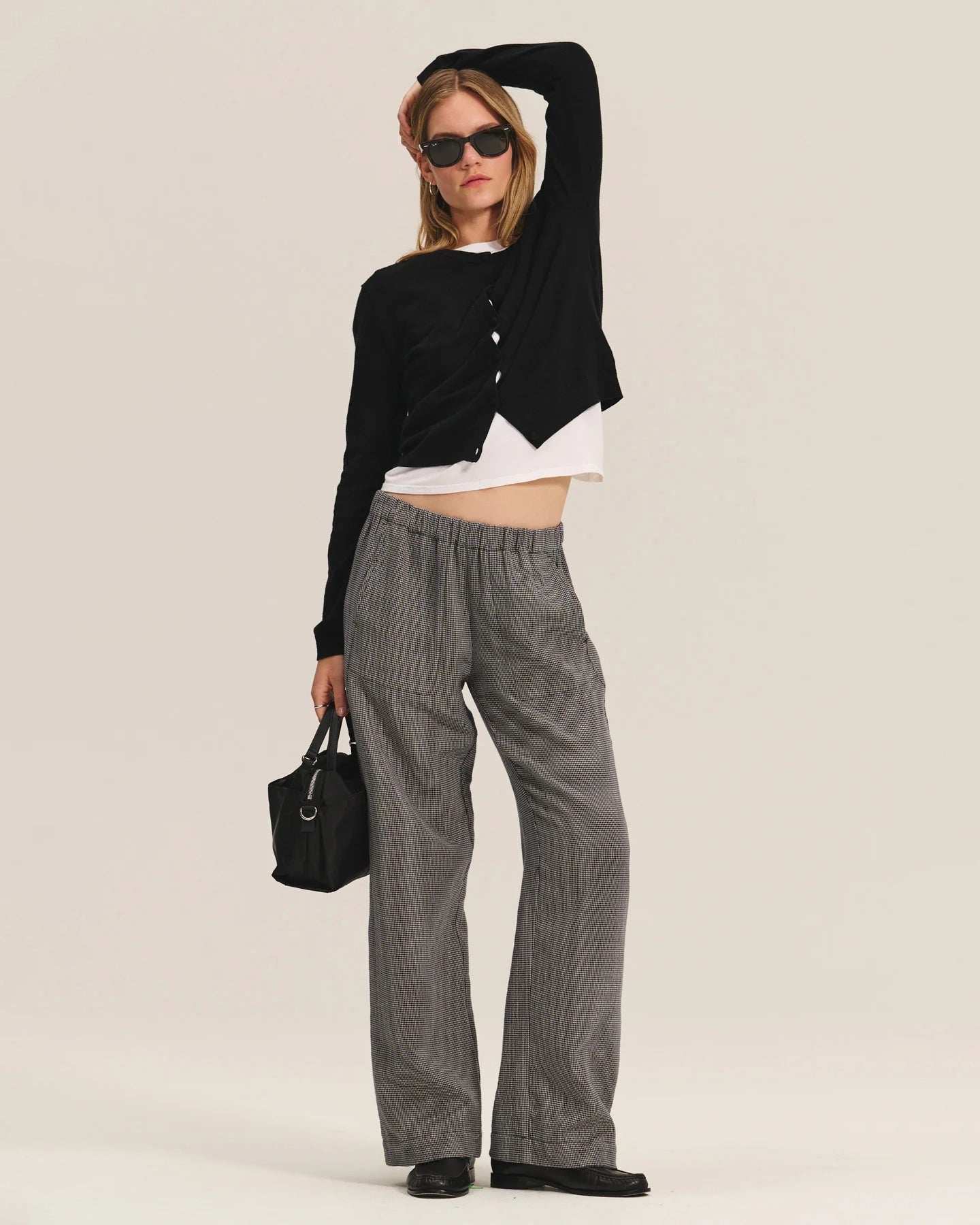 Person wearing gray wide-leg pants