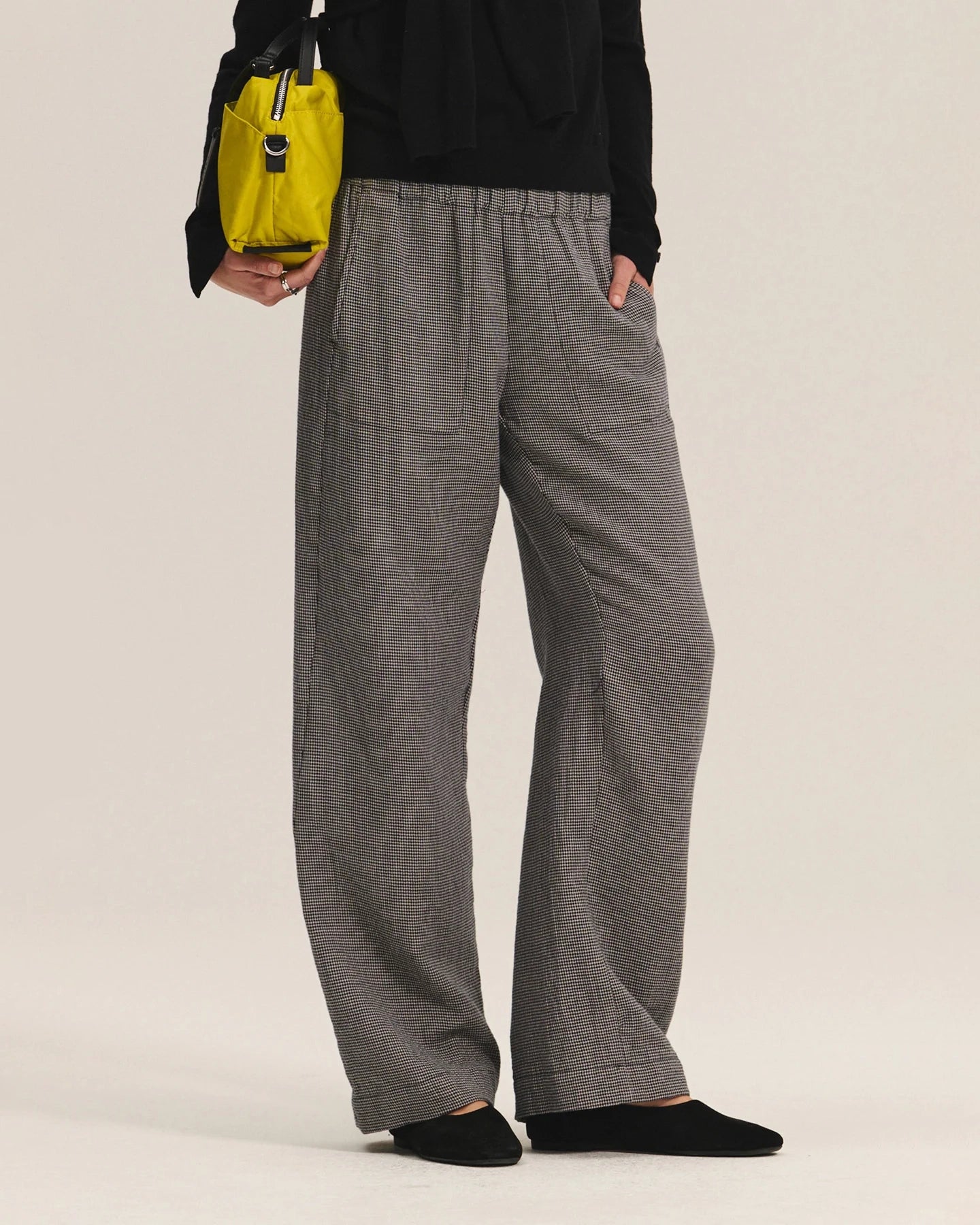 Person wearing gray wide-leg pants