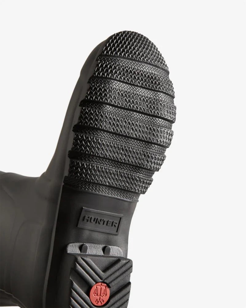 A black Hunter Original Tall Boot, featuring a side buckle and a tread pattern