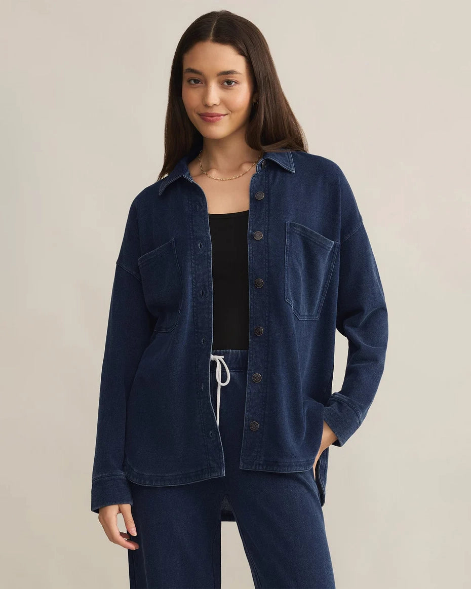 Woman wearing a blue denim button down jacket