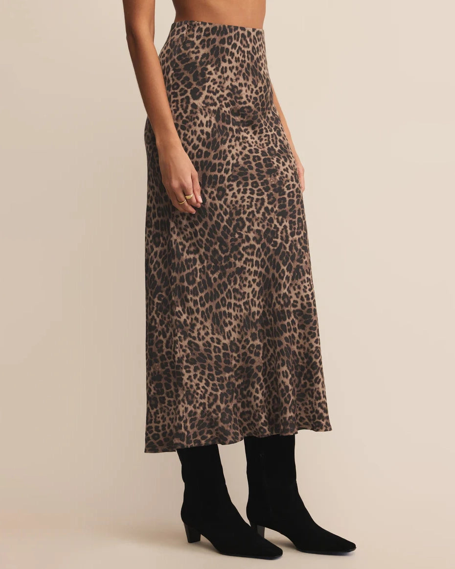 woman wearing a leopard print midi skirt