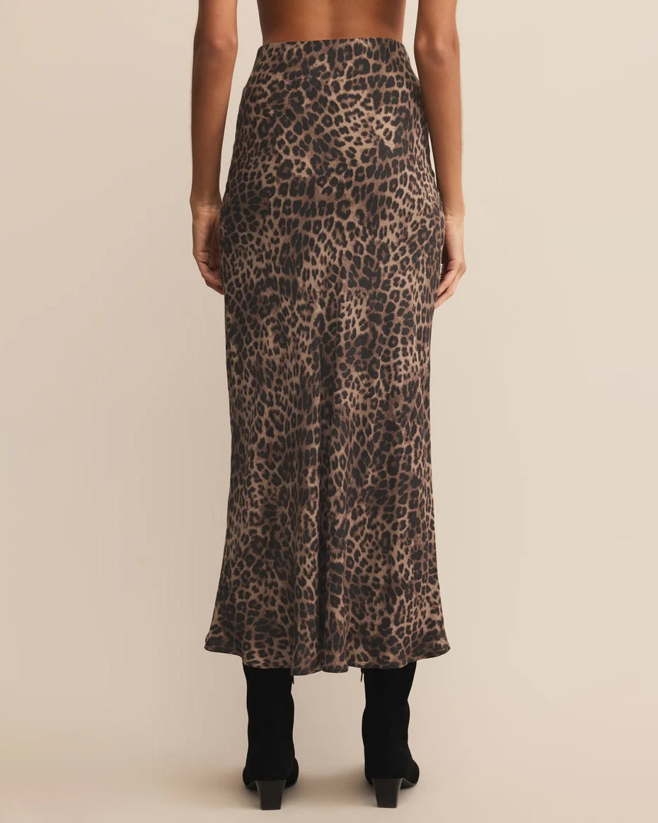woman wearing a leopard print midi skirt