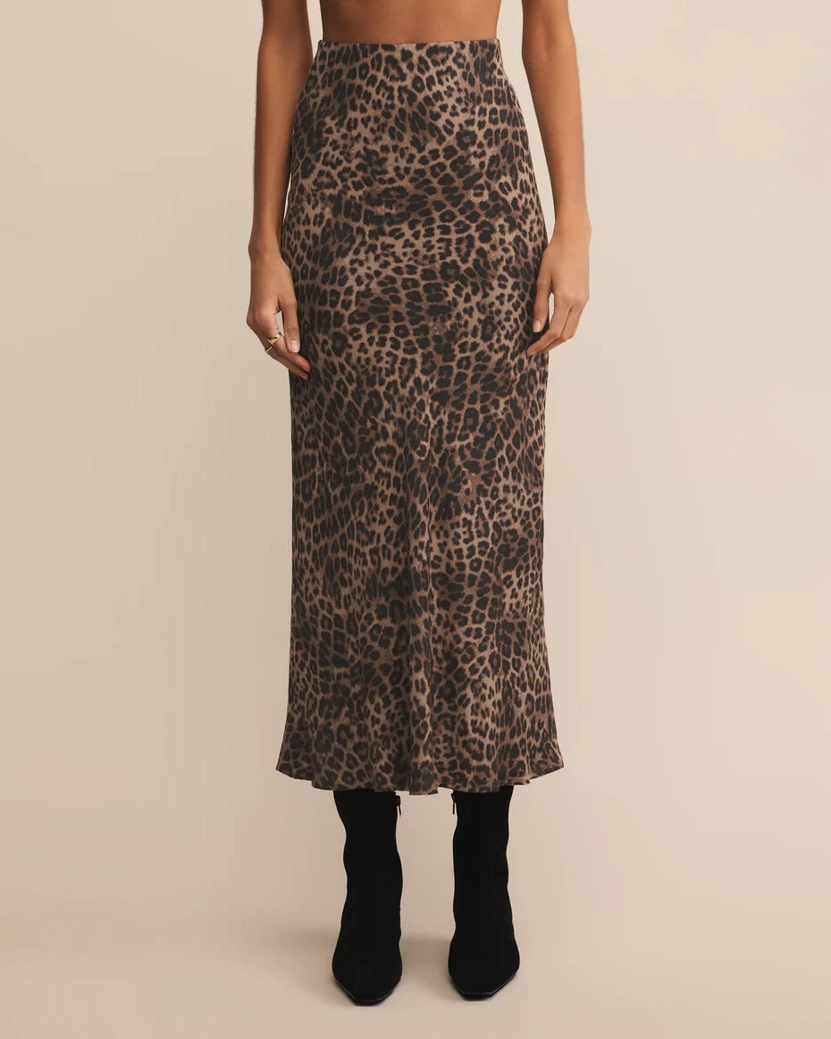 woman wearing a leopard print midi skirt