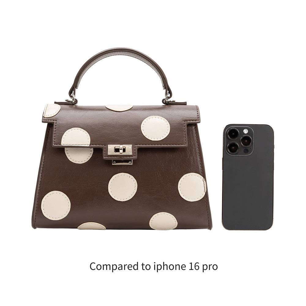 brown hand bag with cream polka dots