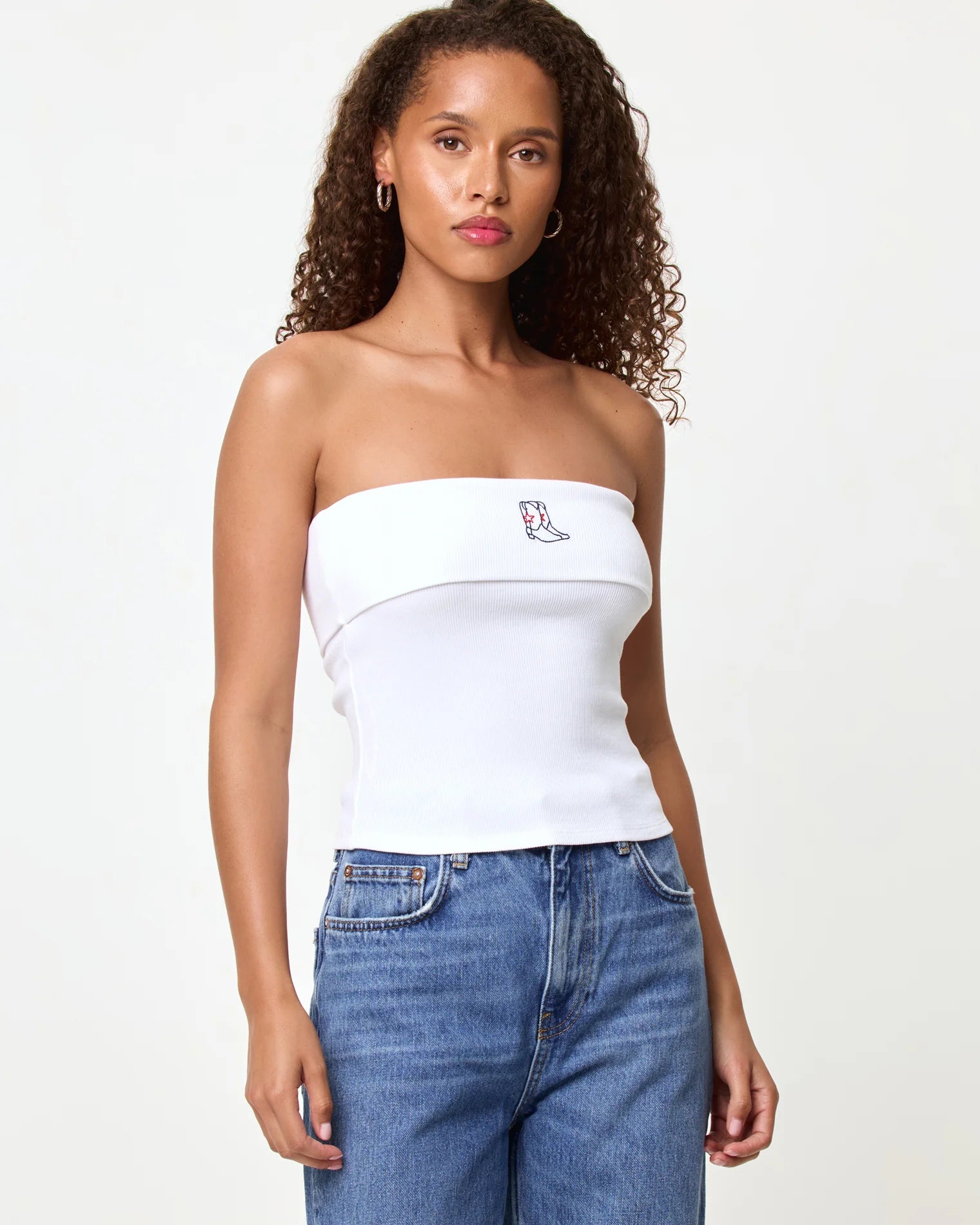 strapless white tube top with cowboy boots embroidered on the top