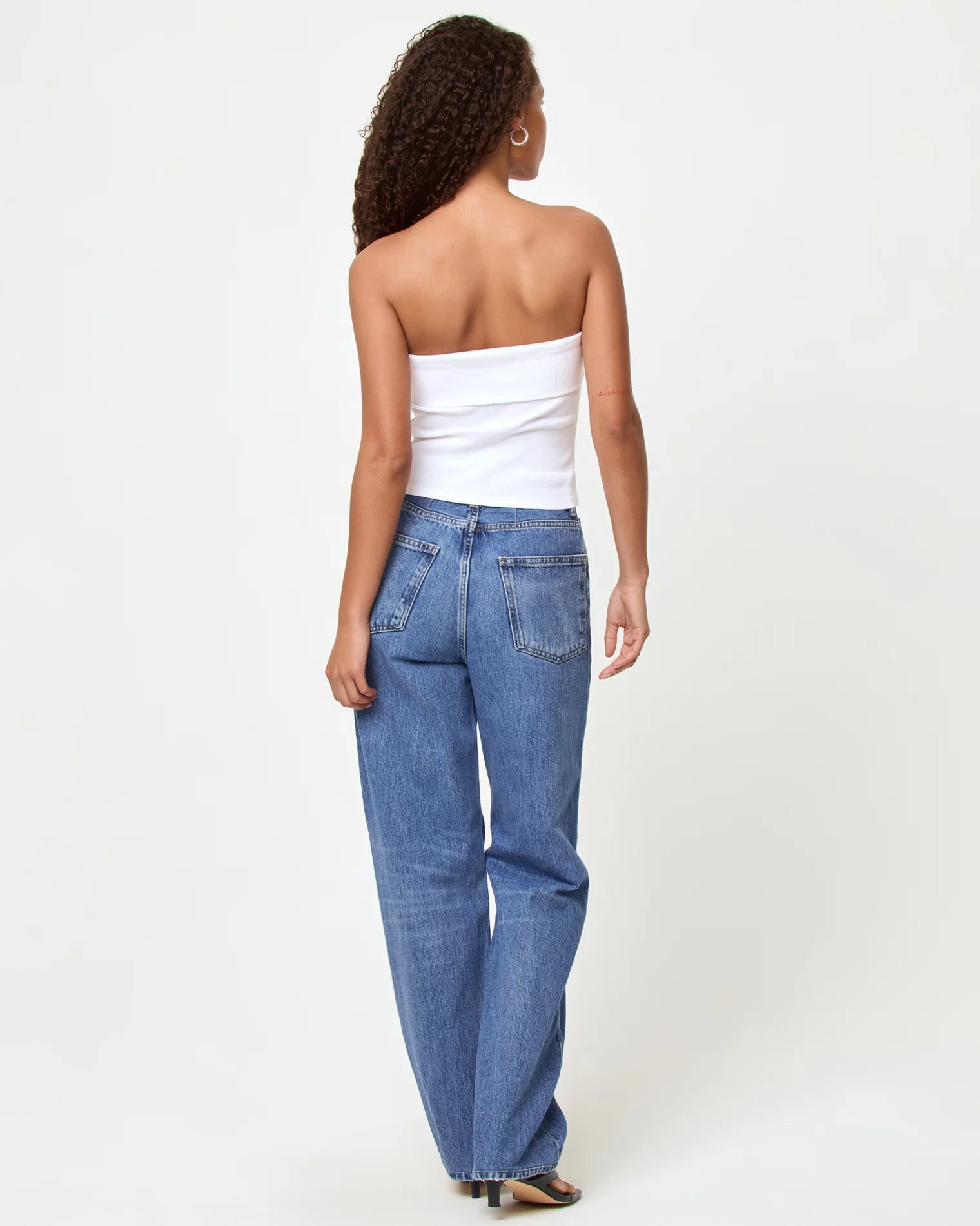 strapless white tube top with cowboy boots embroidered on the top