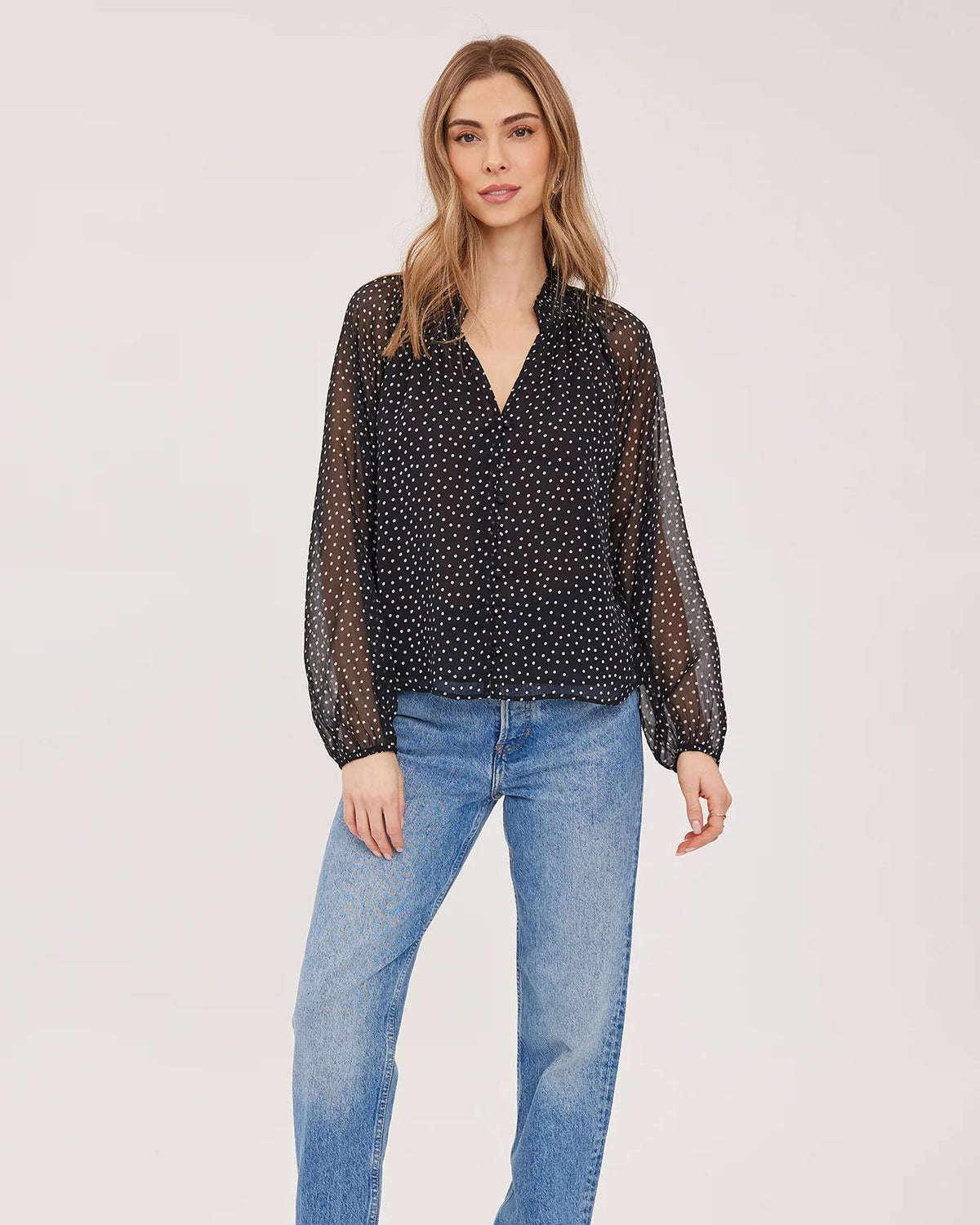 black blouse with white polka dots