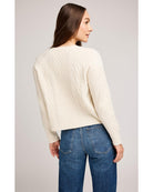 cream knit sweater with buttons half way down