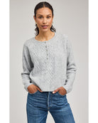 grey knit sweater with buttons half way down