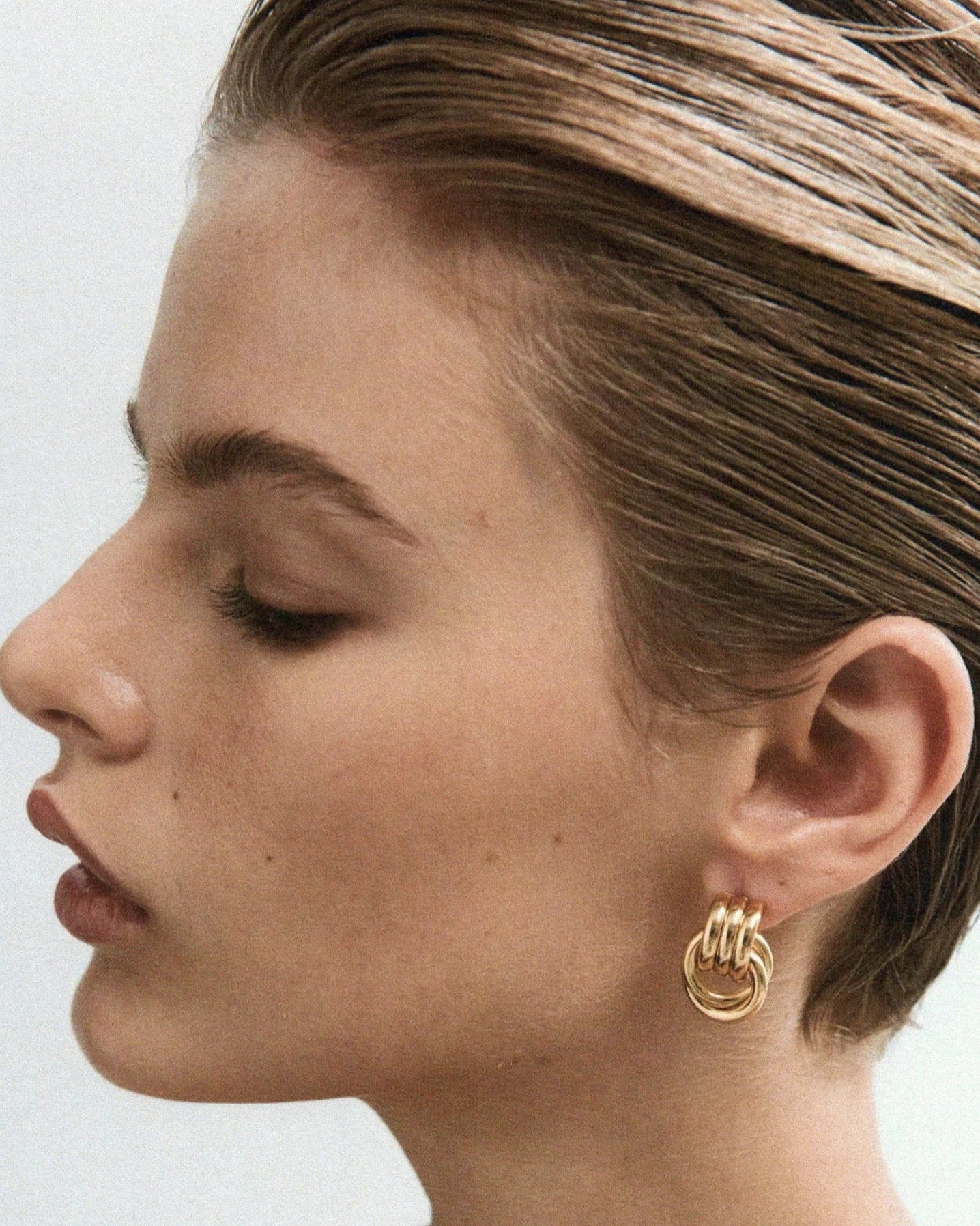 statement knot gold earrings