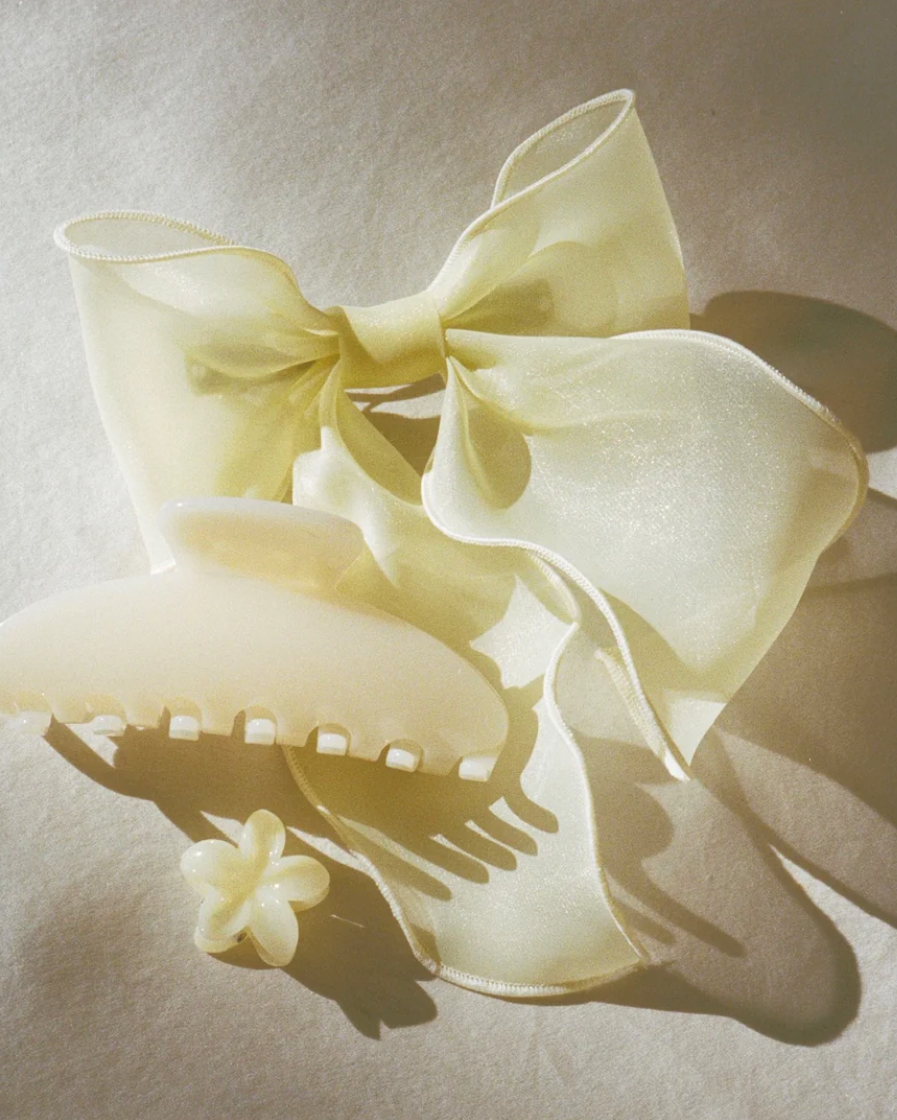 two mini flower claw clips in yellow