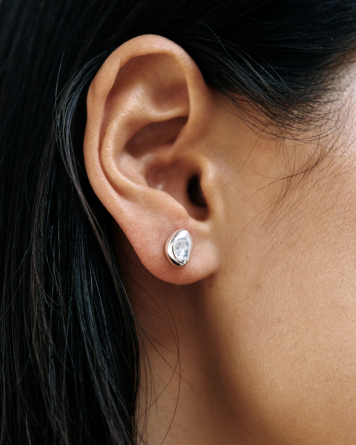 silver studs in the shape of a bean