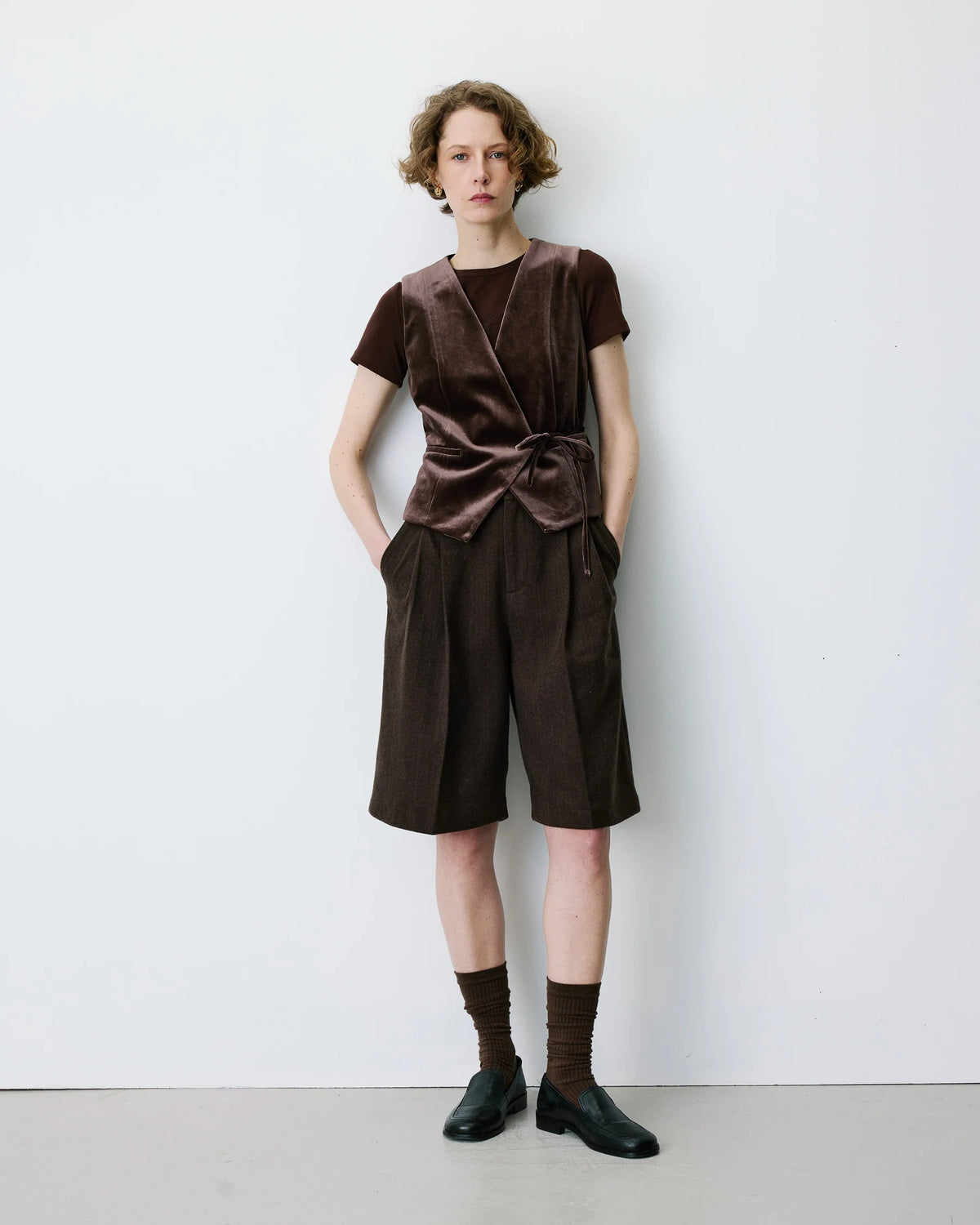 velvet brown vest with a tie