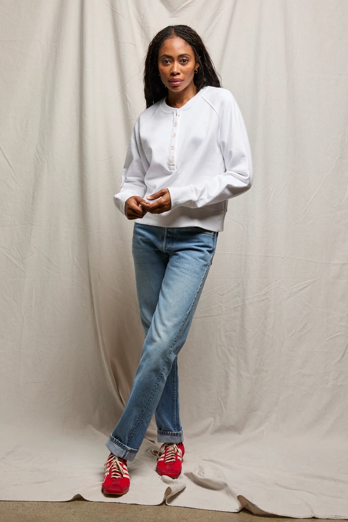 white sweater with buttons halfway down