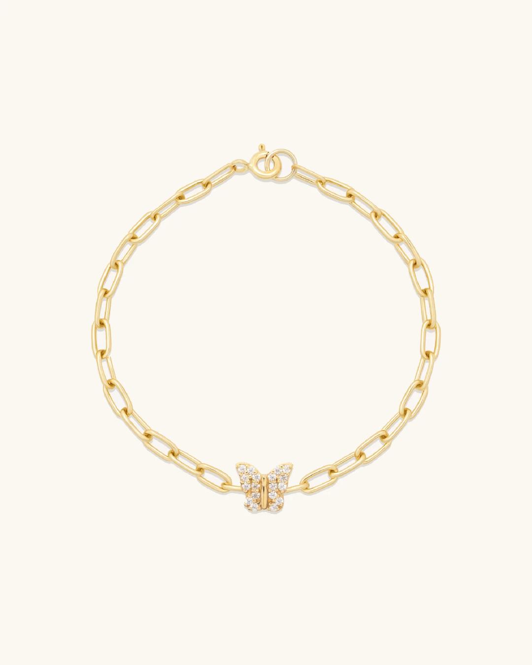 gold link bracelet with a butterfly charm
