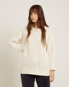 white sweater with knit details