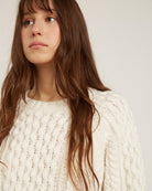 white sweater with knit details