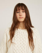 white sweater with knit details