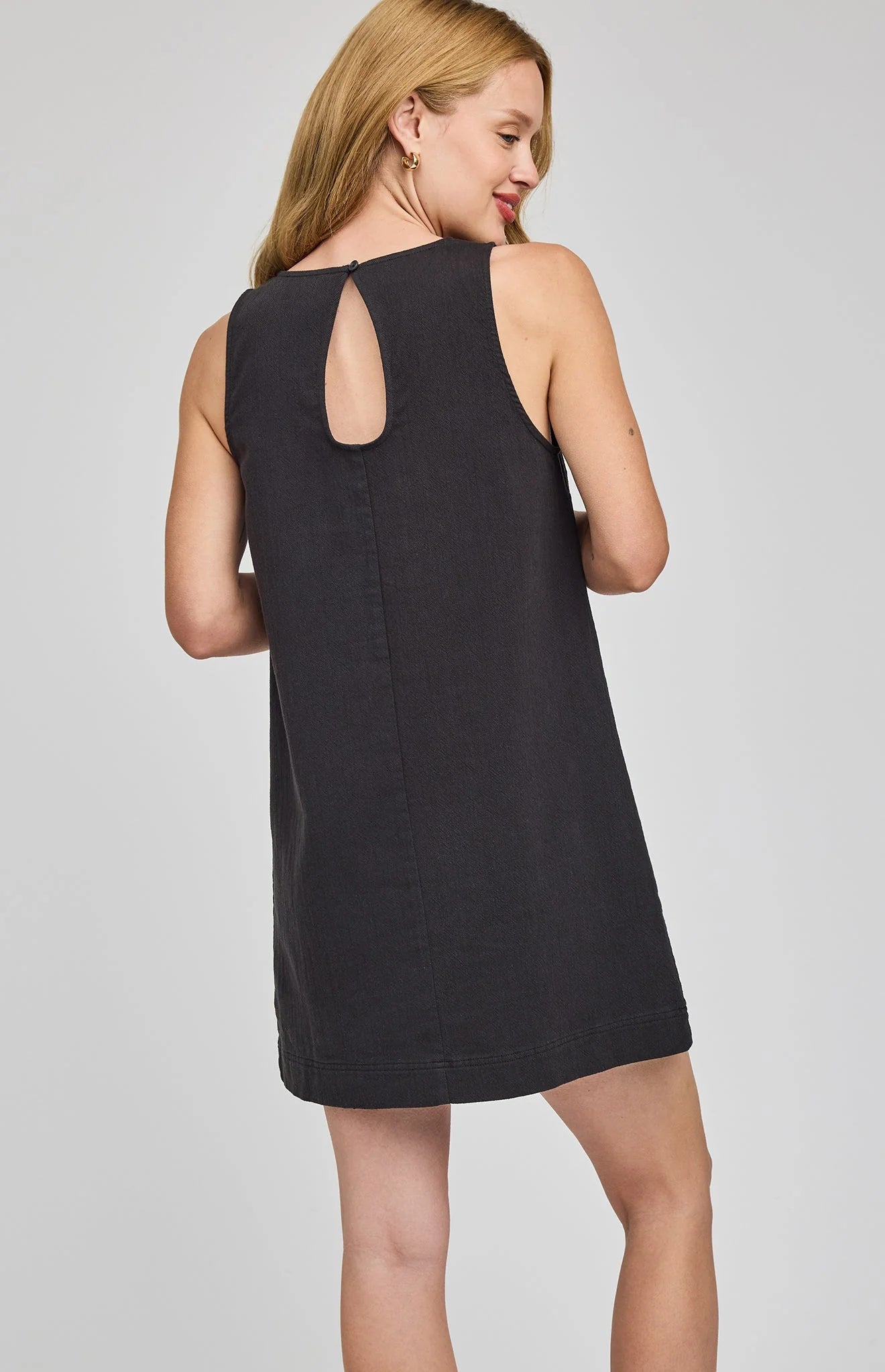 mini black dress with two pockets on the front
