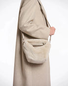 small crossbody bag in a beige faux fur