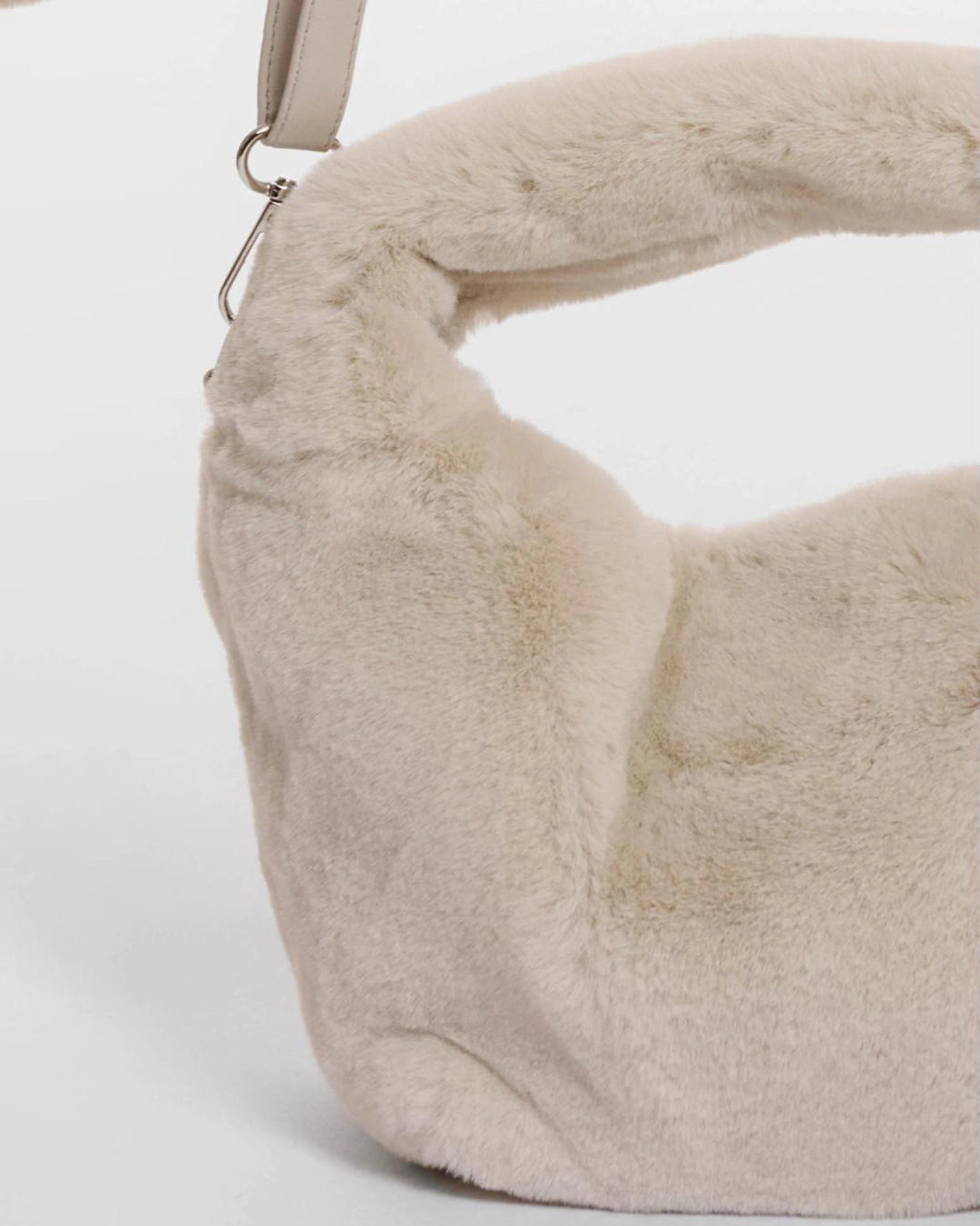 small crossbody bag in a beige faux fur