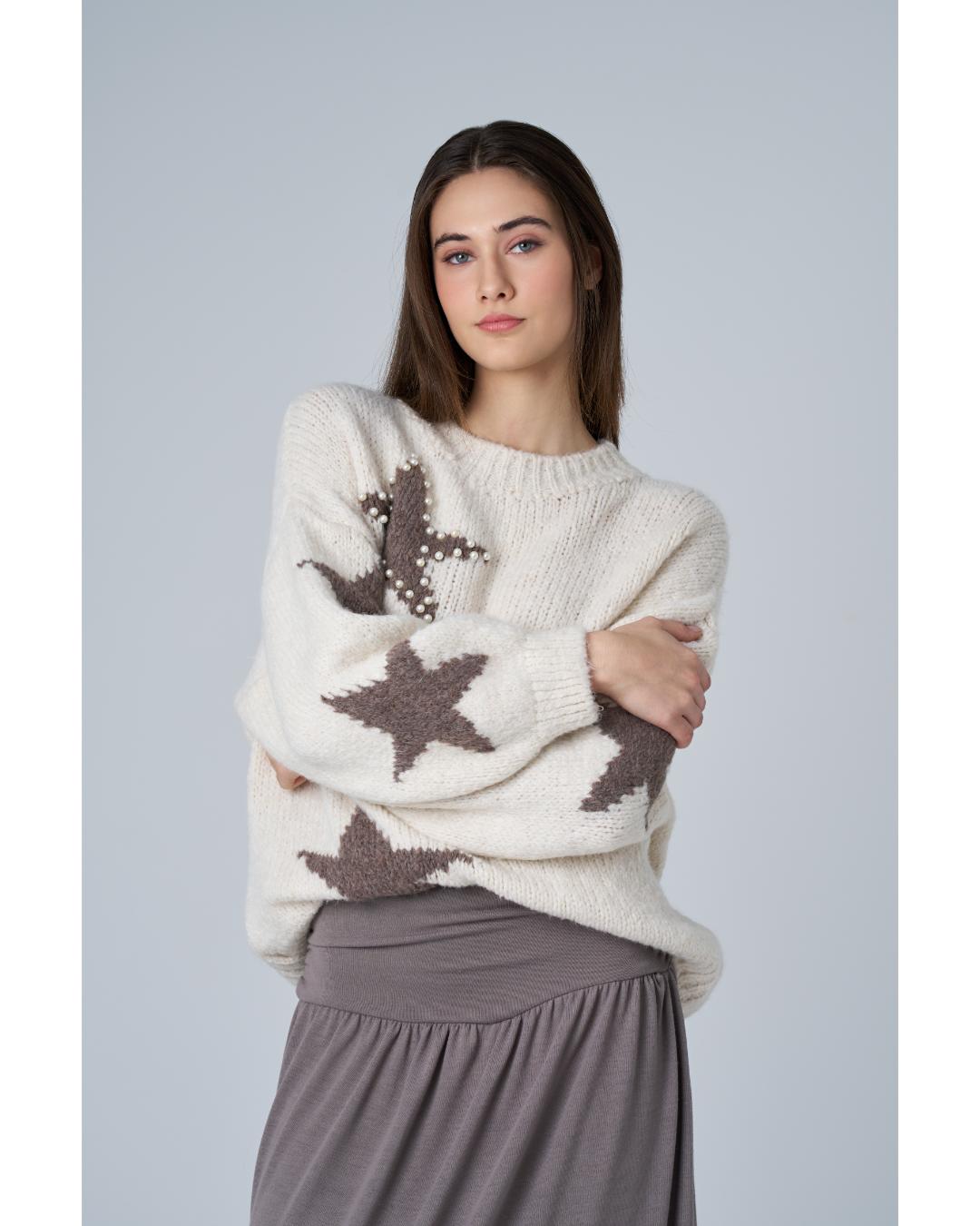 cream sweater with brown stars on it