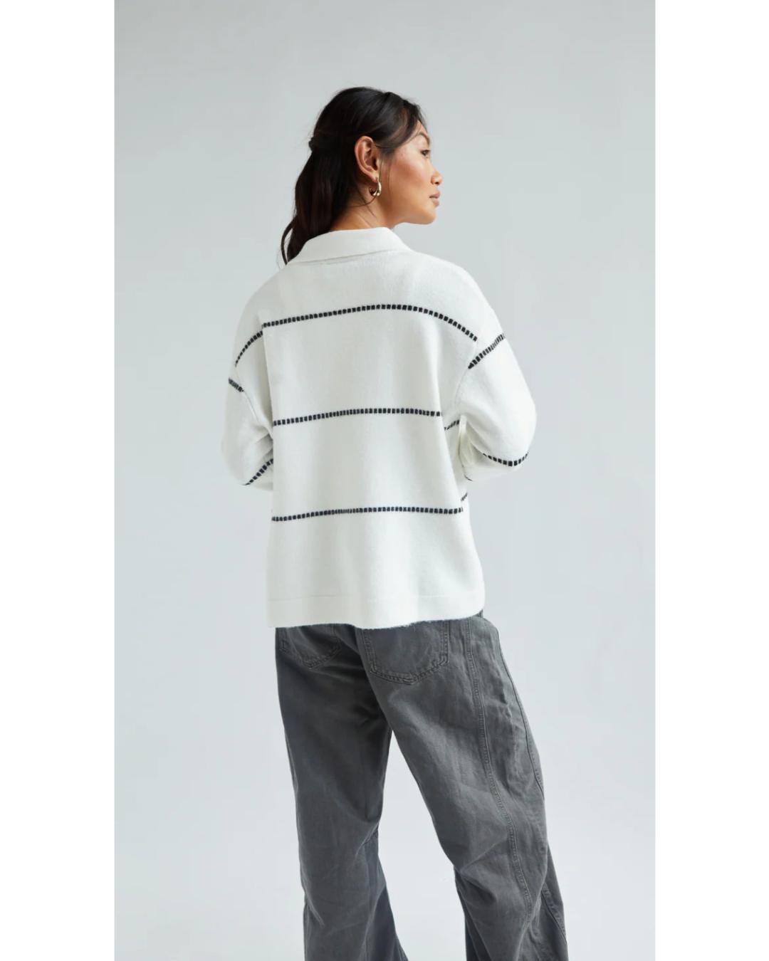 white cardigan with a collar and with black stripes
