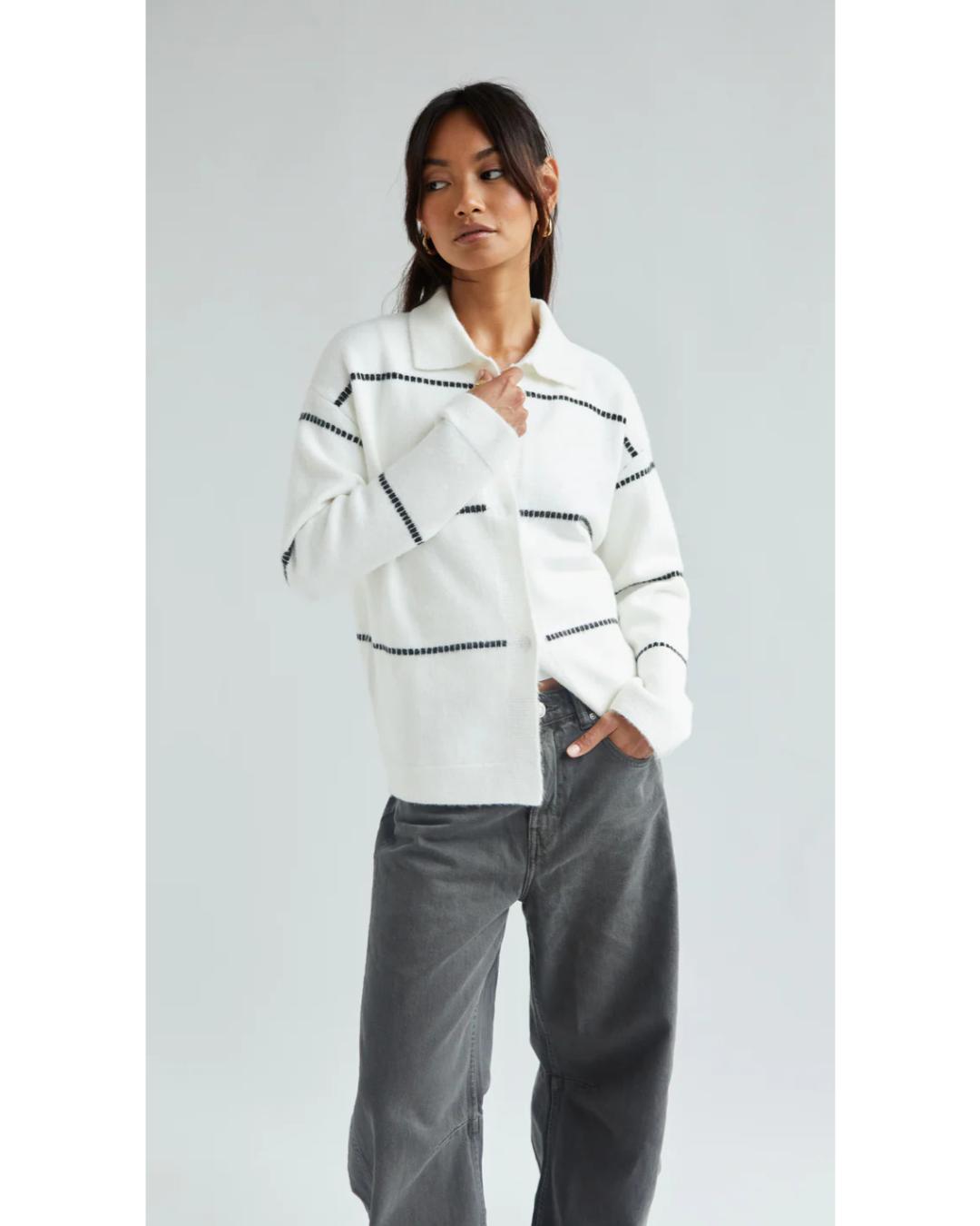 white cardigan with a collar and with black stripes