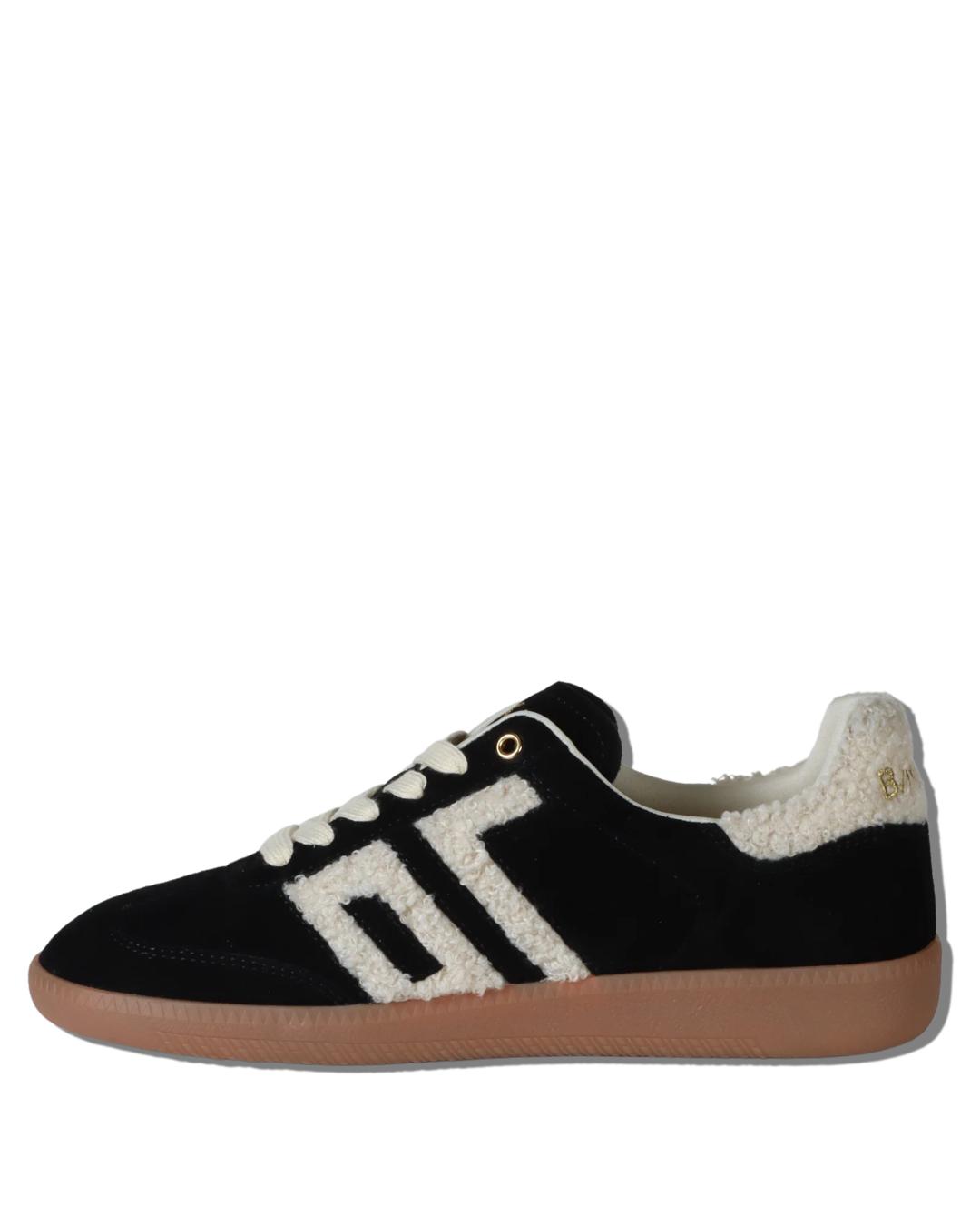 black suede sneaker with 70 written in white