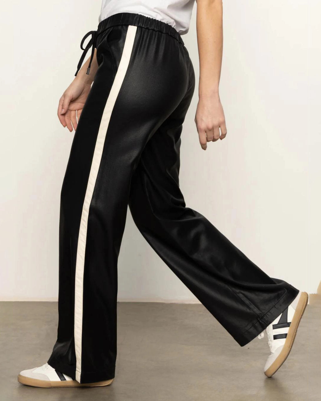 black track pant with white stripe down the side