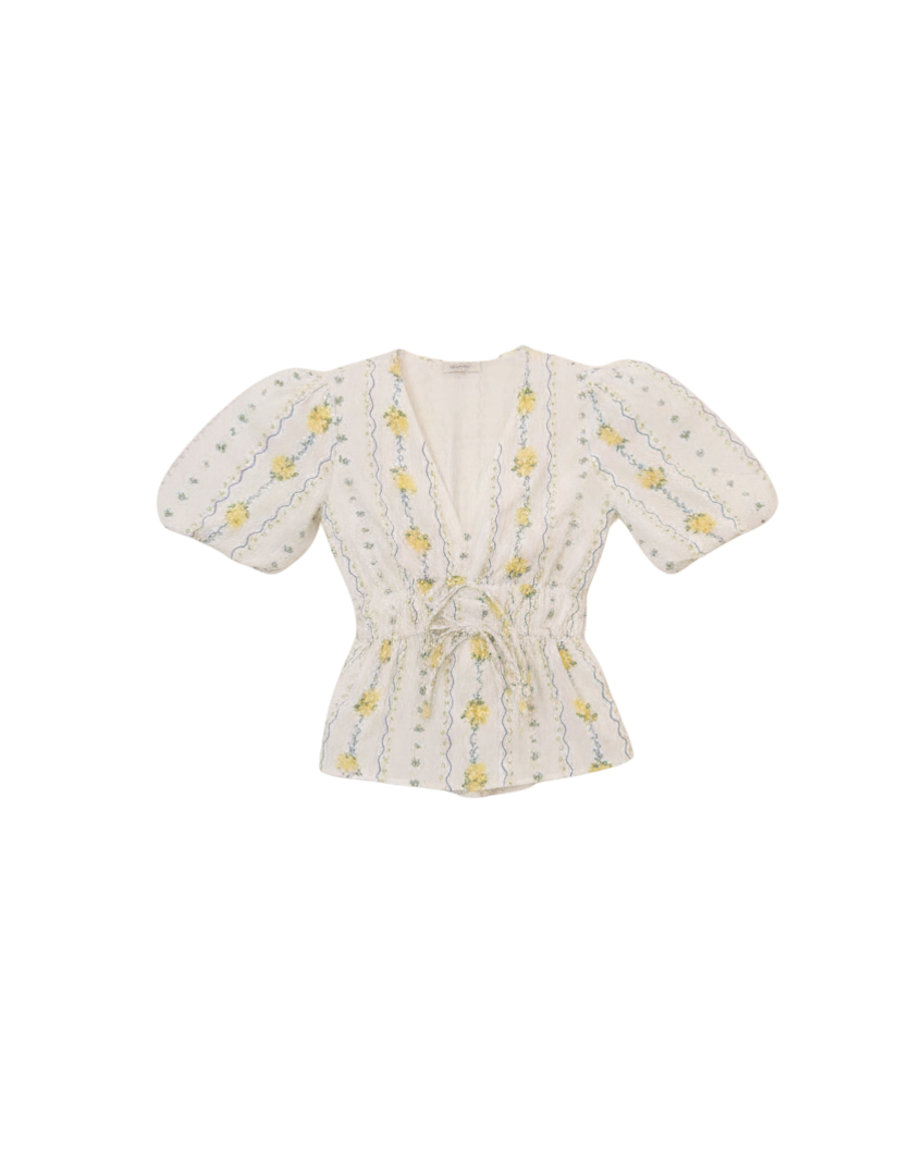 white top with a puff sleeve and yellow flowers