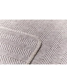 beige blanket with herringbone pattern