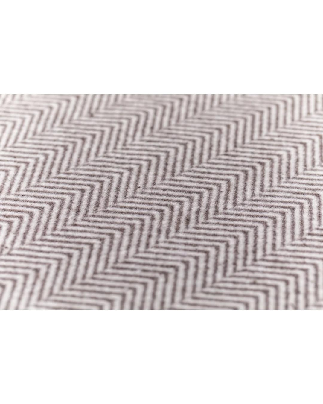 beige blanket with herringbone pattern