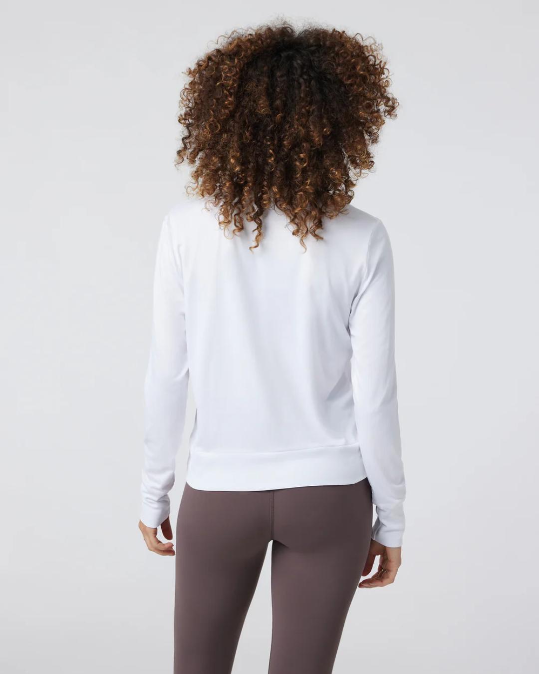 back view of a white active wear long sleeve top