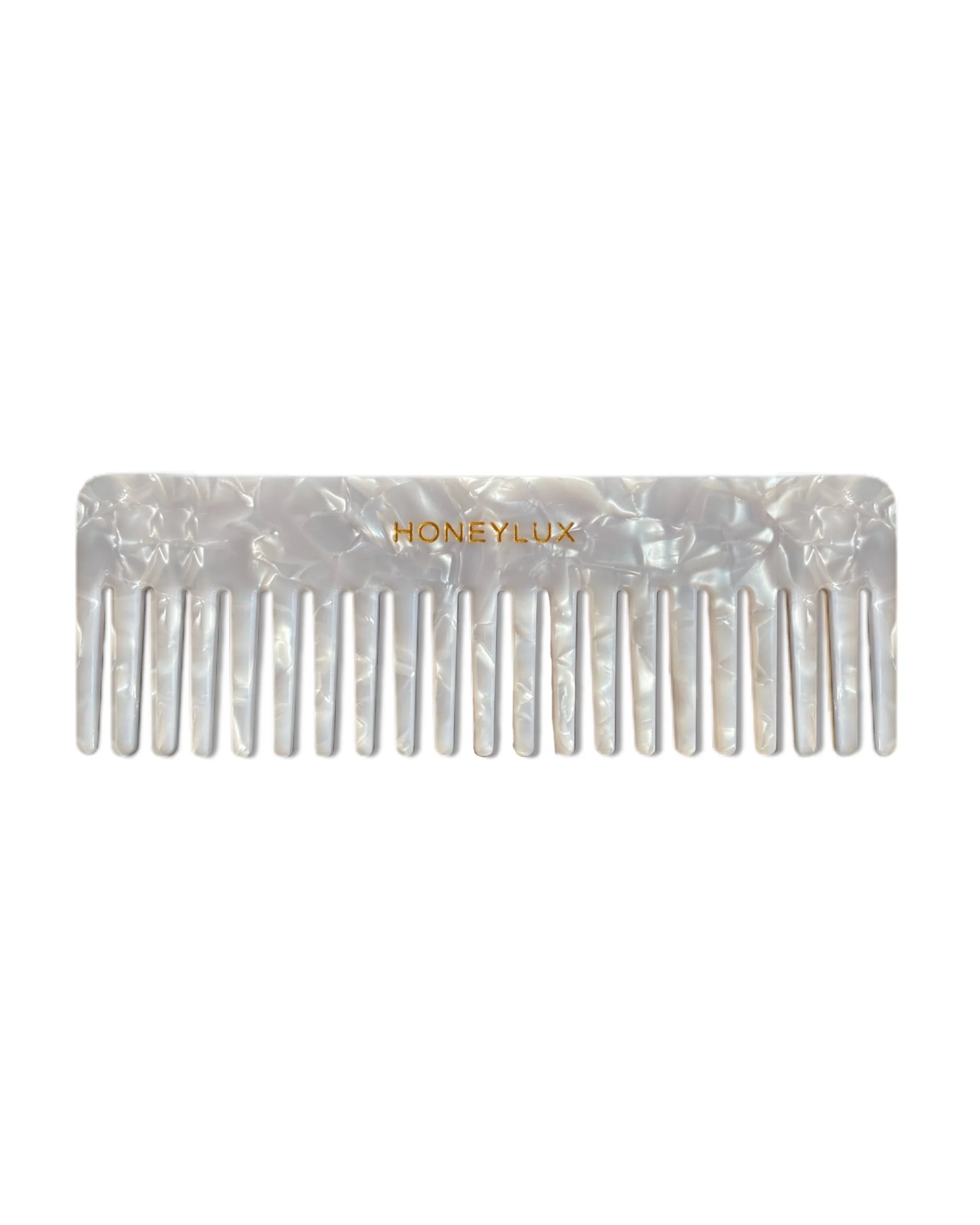 Hair comb with 'Honeylux' branding