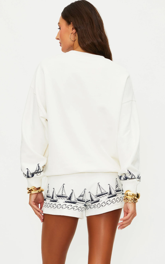 white lounge shorts with navy sailboats on the bottom