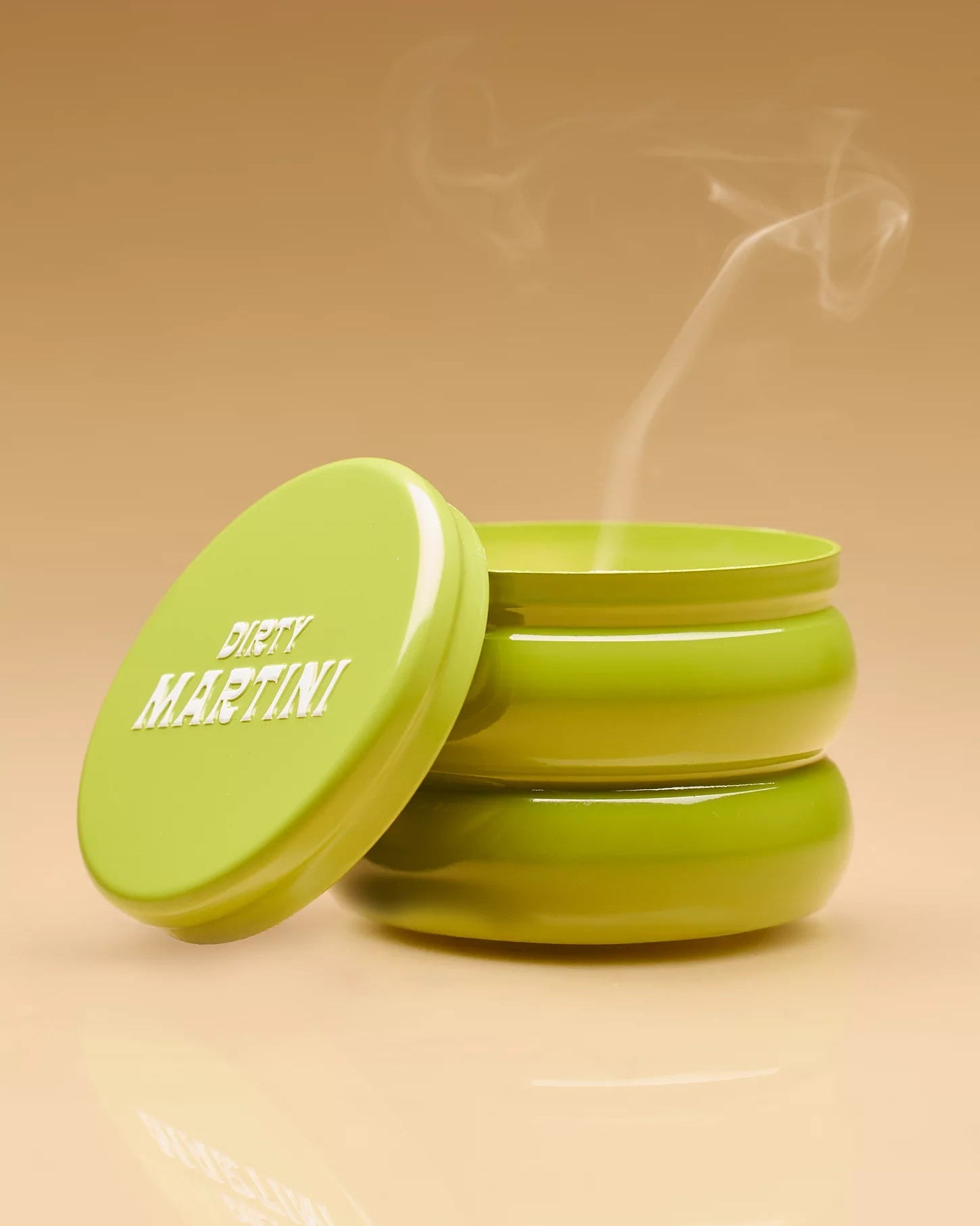 candle in a green tin