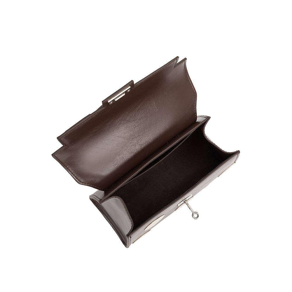 brown hand bag with cream polka dots