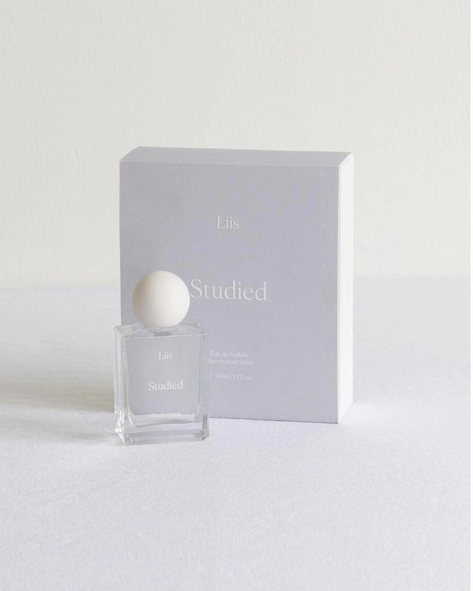 Perfume bottle with packaging labeled 'Studled' on a white background