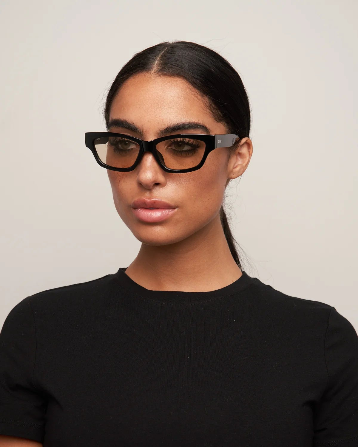 cat eye statement sunglasses with black frame and brown lenses