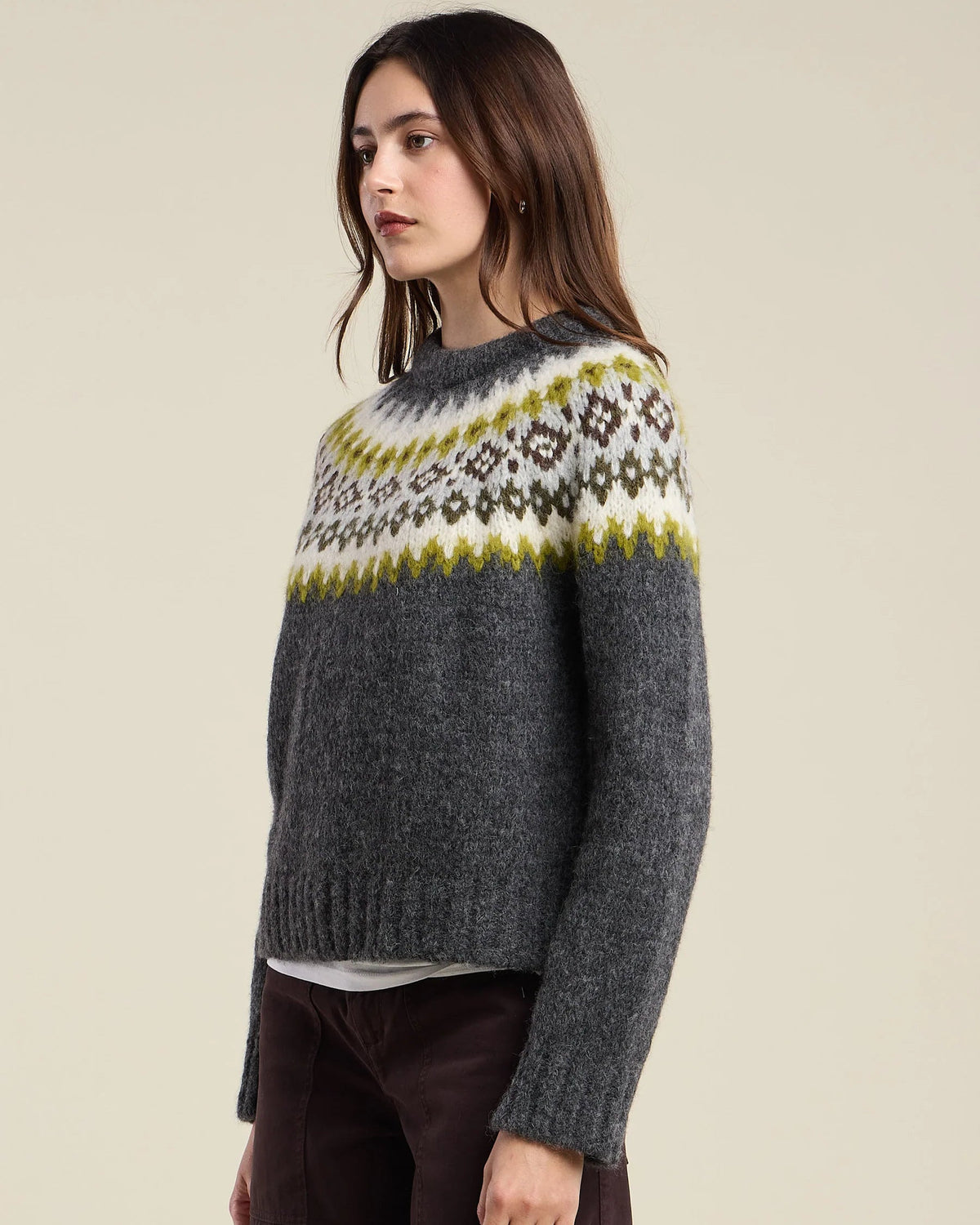 grey knit sweater with green and grey fair isle design on the top