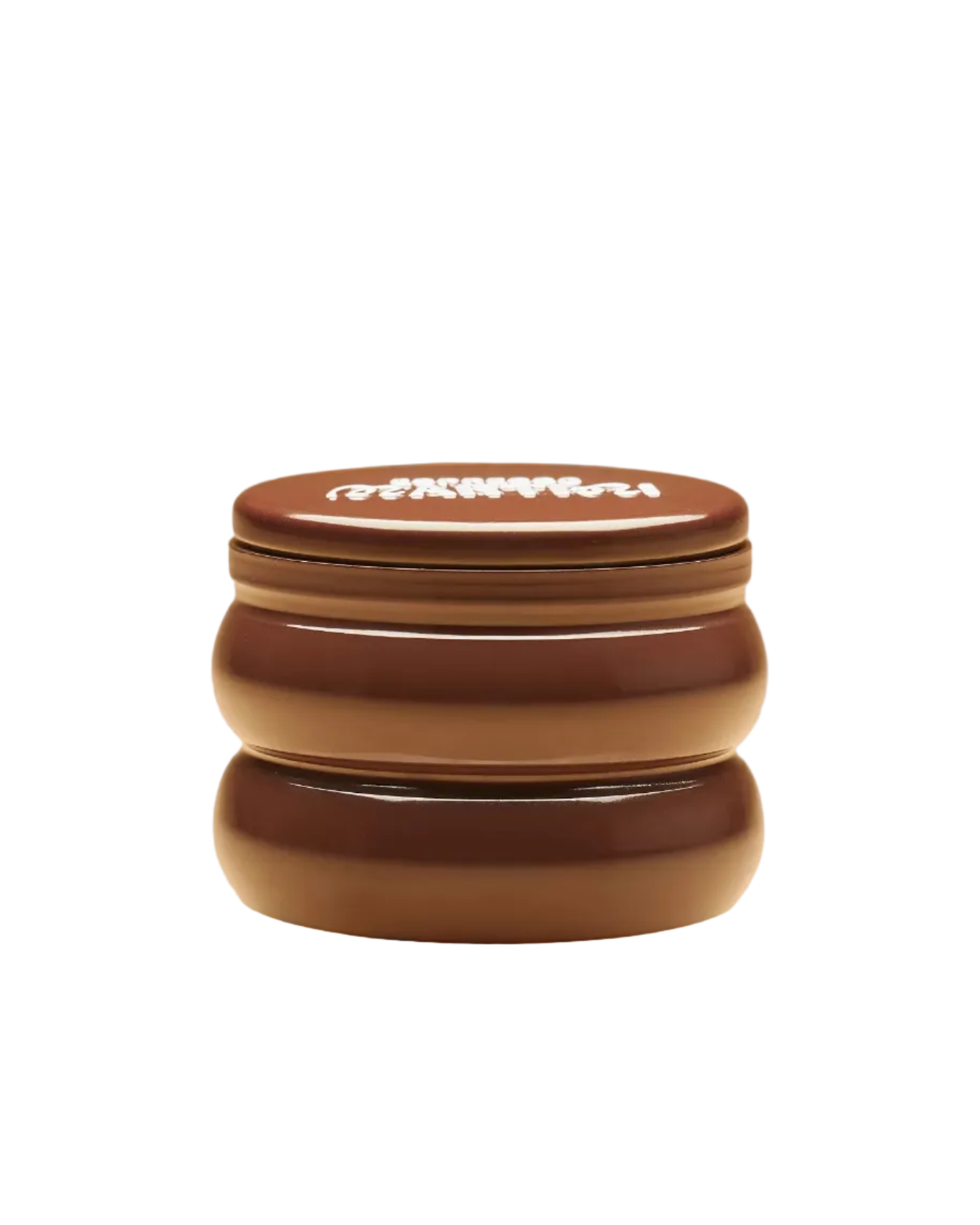 candle in a brown tin