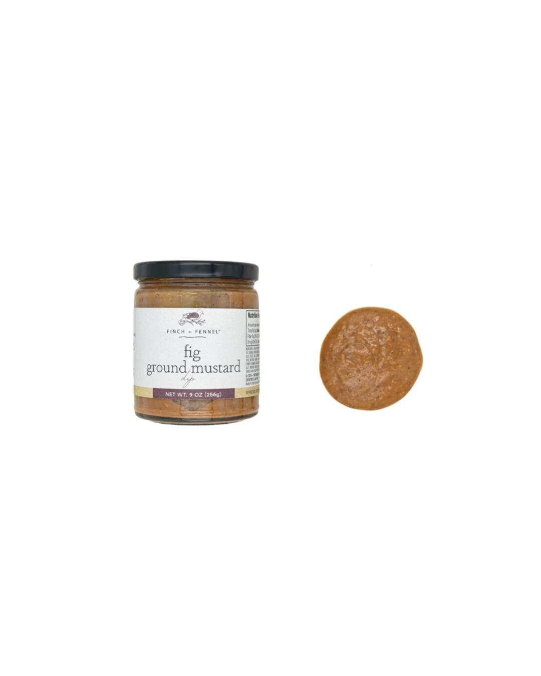 Jar of fig ground mustard with a sample on a white background