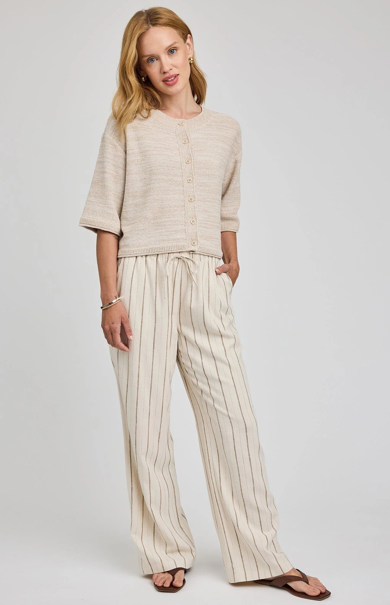 wide leg linen pant in beige with a stripe down them
