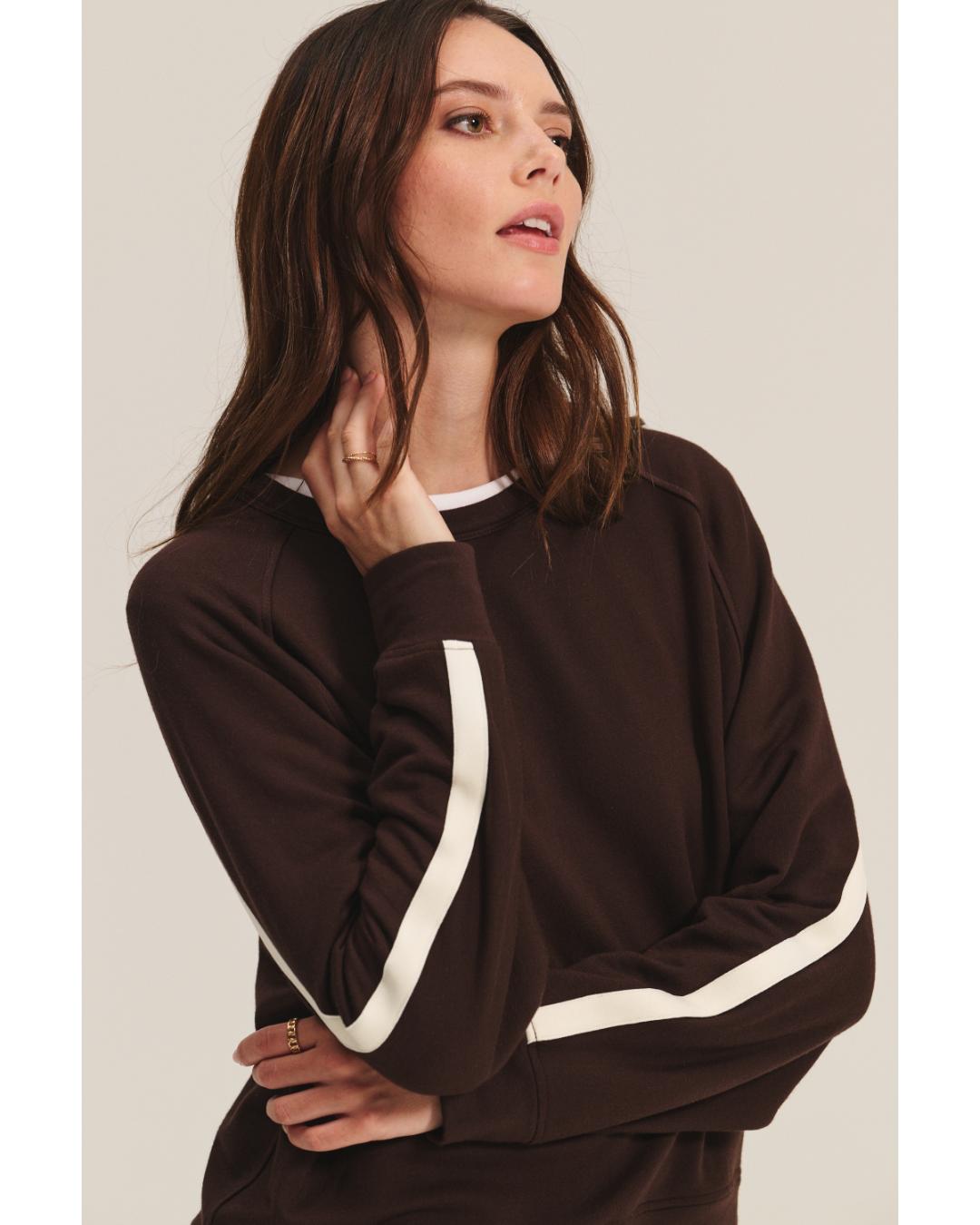brown sweatshirt with a cream stripe through the back and arms