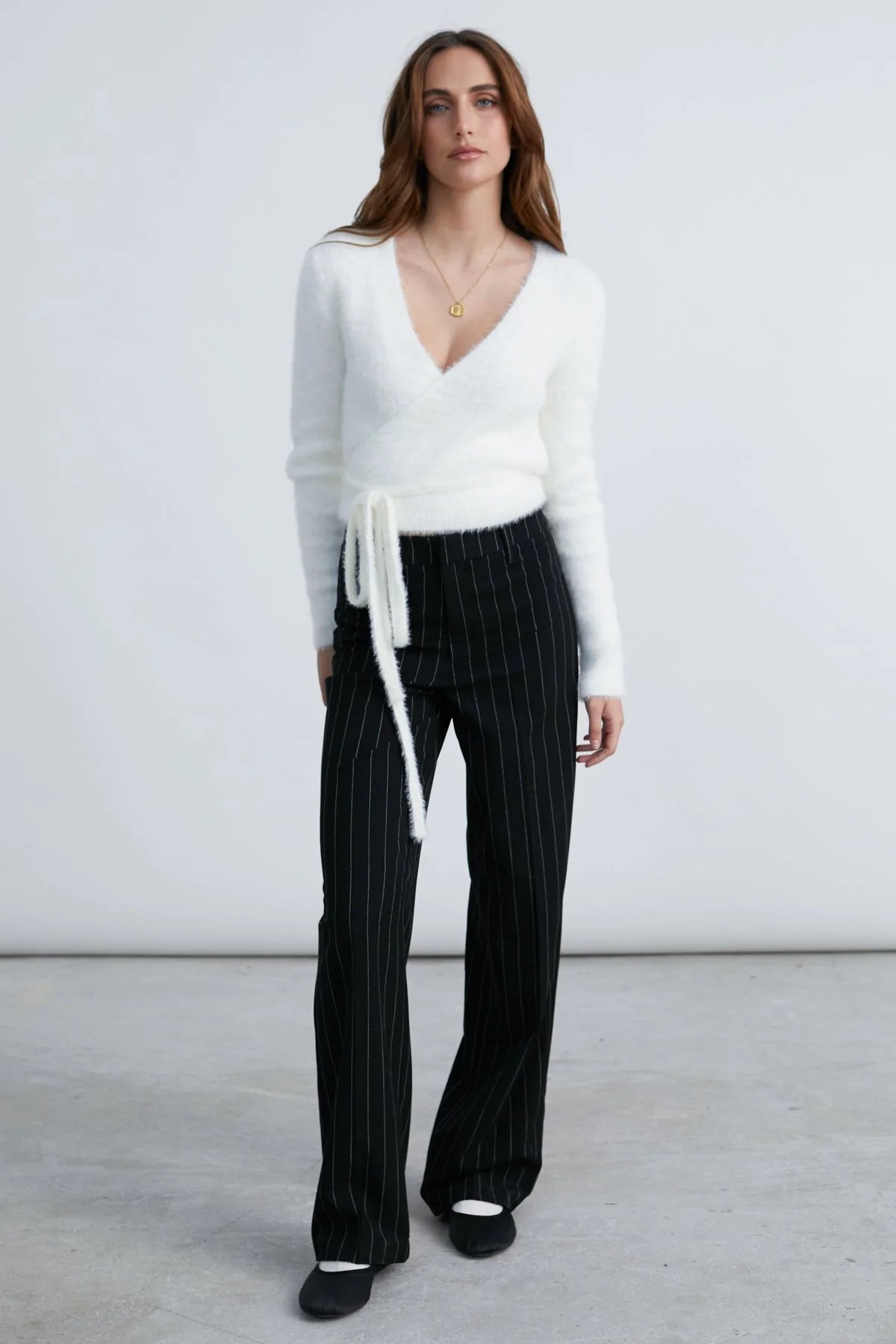 fuzzy white cardigan that wraps at the waist