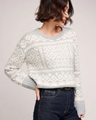 a woman wearing a cream and grey patterned fairisle sweater by gentle fawn